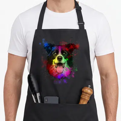 Tablier de cuisine noir avec portrait artistique d'un Border Collie aux teintes rainbow etes éclaboussures colorées.