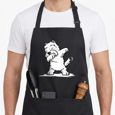Tablier de cuisine noir avec un West Highland White Terrier blanc effectuant une pose de dab dance stylisée.