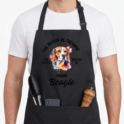Tablier de cuisine noir avec portrait aquarellé d'un beagle et texte humoristique en noir.
