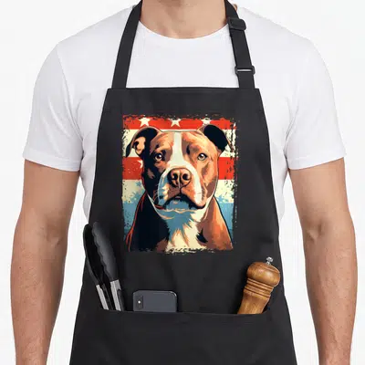 Tablier de cuisine noir avec portrait American Pitbull Terrier en style Pop Art sur fond étoilé rouge et bleu.