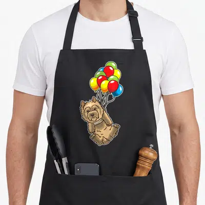 Tablier de cuisine noir avec illustration d'un chien marron attaché à des ballons colorés
