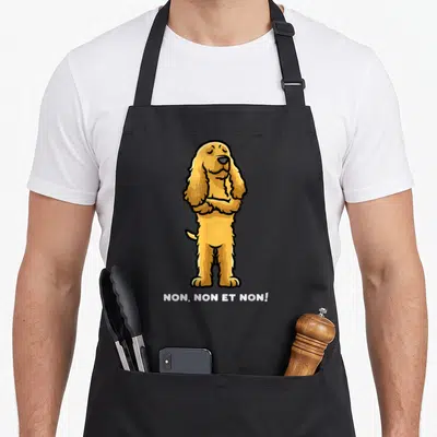 Tablier de cuisine noir avec illustration d'un Cocker Spaniel aux bras croisés et le texte NON, NON ET NON en bas.