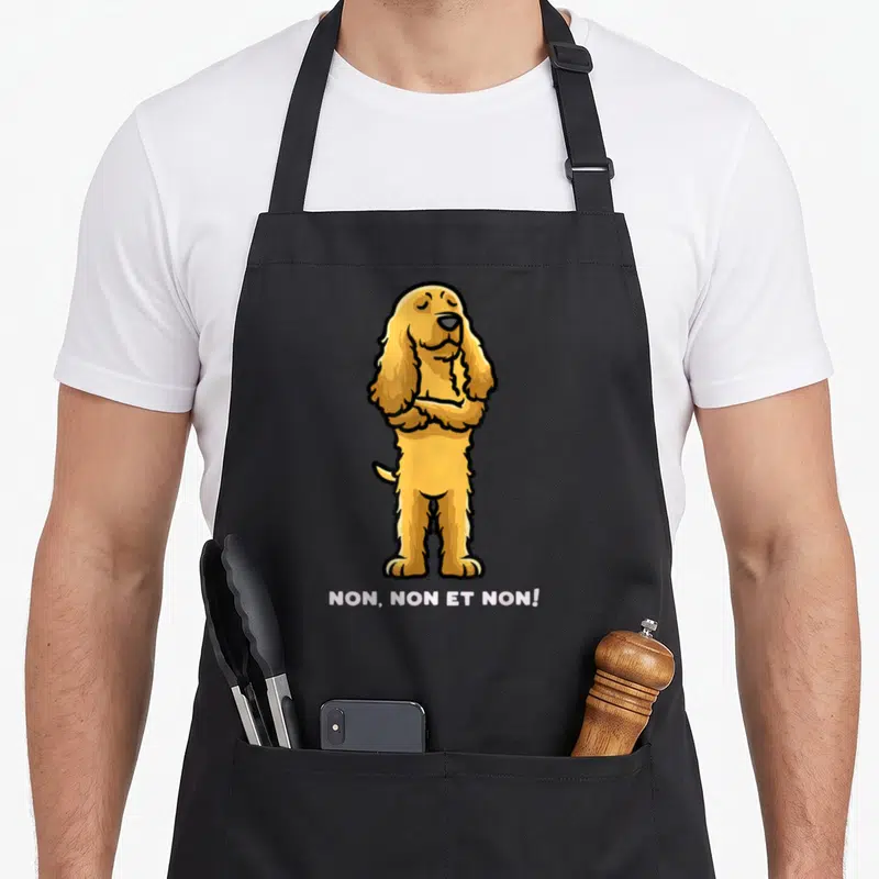 Tablier de cuisine noir avec illustration d'un Cocker Spaniel aux bras croisés et le texte NON, NON ET NON en bas.