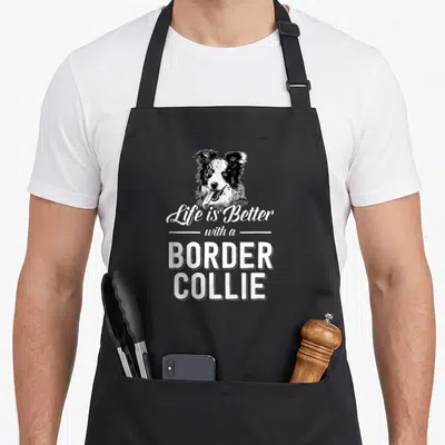 Tablier de cuisine noir avec tête de Border Collie et texte Life is Better with a BORDER COLLIE en blanc.
