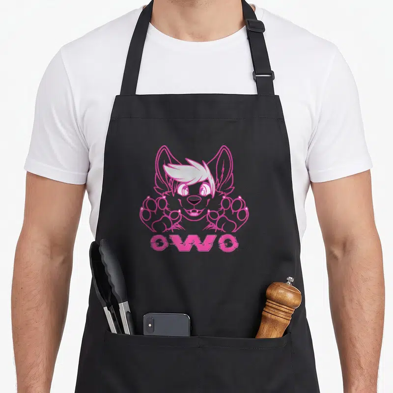 Tablier de cuisine noir avec illustration d'un chiot rose kawaii et le texte OwO en bas.