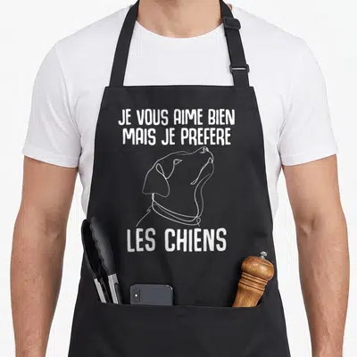 Tablier de cuisine noir avec dessin de chien et texte Je vous aime bien mais je préfère les chiens en blanc.