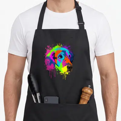 Tablier de cuisine noir avec portrait Golden Retriever en art splash multicolore et coulures de peinture.