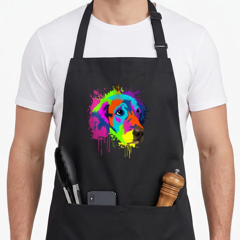 Tablier de cuisine noir avec portrait Golden Retriever en art splash multicolore et coulures de peinture.