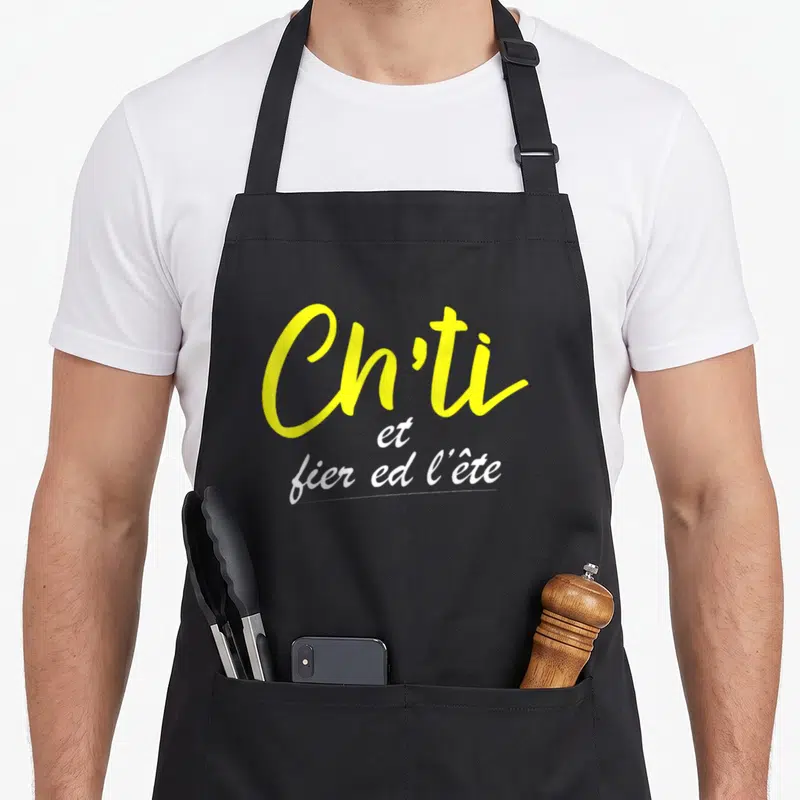 Tablier de cuisine noir avec l'inscription Ch'ti et fier ed l'ête en jaune et blanc