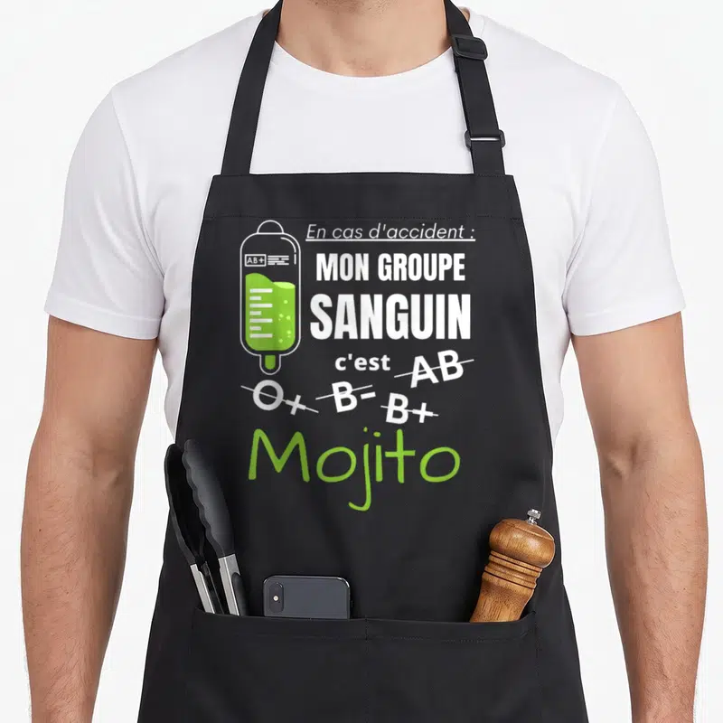 Tablier de cuisine noir avec illustration poches à droites et texte blanc vert sur fond gris uni