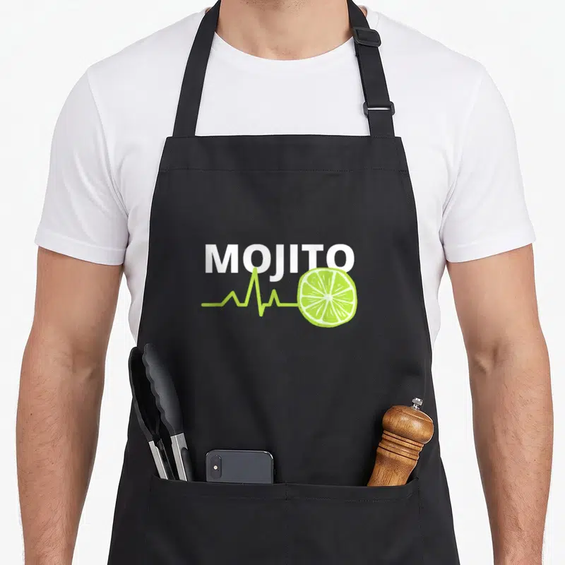Tablier de cuisine noir avec l'inscription MOJITO et une ligne ECG reliant un citron vert au texte.
