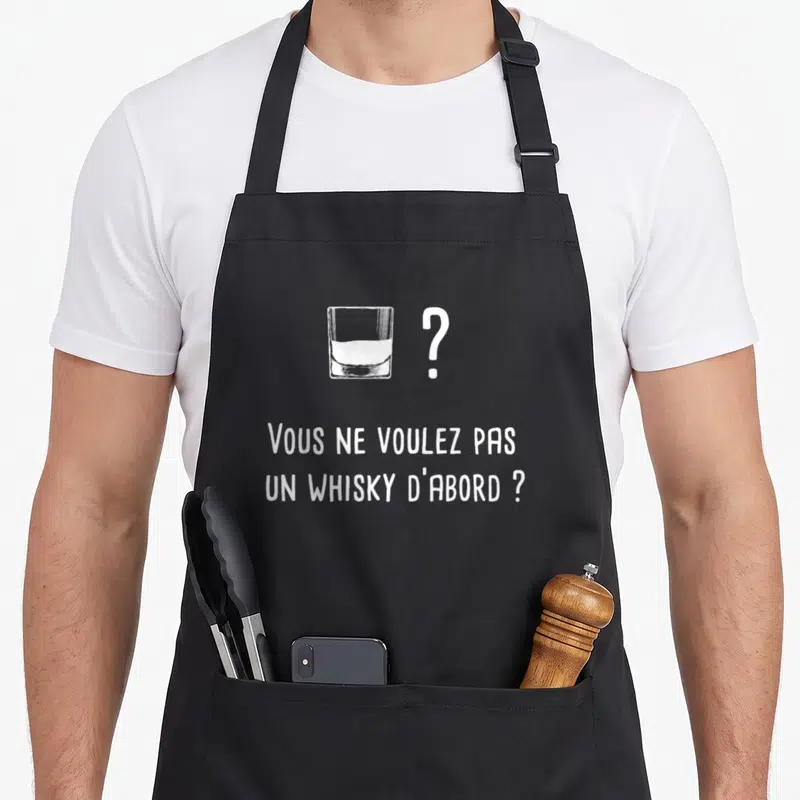 Tablier de cuisine noir avec un verre de whisky dessiné et la phrase Vous ne voulez pas un whisky d'abord en blanc.