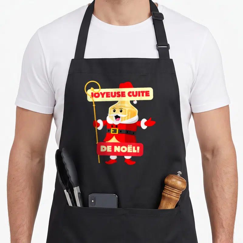 Tablier de cuisine noir avec une illustration de bouteille Santa tenant une enseigne Joyeuse Cuite de Noël.