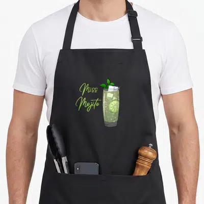 Tablier de cuisine noir avec illustration d'un verre de Mojito garni de menthe et de lime, texte Miss Mojito en vert fluo.