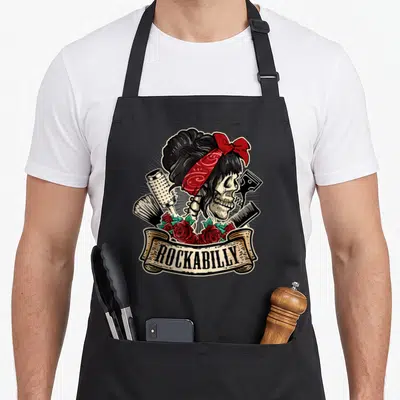 Tablier de cuisine noir avec illustration skull pin-up rockabilly coiffeuse et roses rouges.