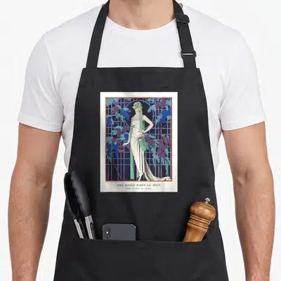 Tablier de cuisine noir avec une illustration vintage d'une femme en robe blanche entourée de grappes de raisin bleu et vert.