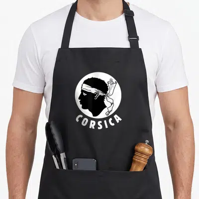 Tablier de cuisine noir avec tête de Maure profil et inscription Corsica en blanc
