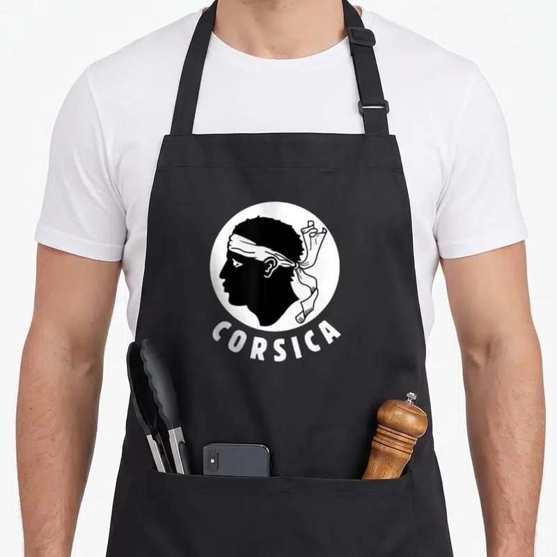 Tablier de cuisine noir avec tête de Maure profil et inscription Corsica en blanc