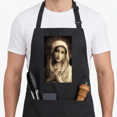 Tablier de cuisine noir avec une illustration de la Vierge Marie Maria aux mains jointes et halo rayonnant en tons sépia.