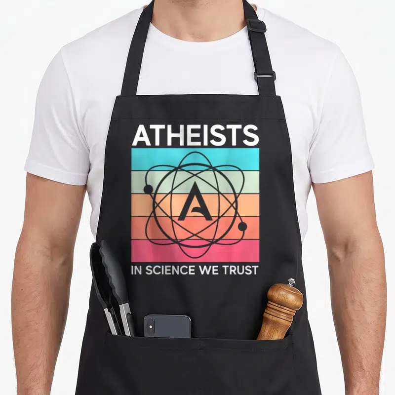Tablier de cuisine noir avec motif atomique coloré et texte athée dans la science en laquelle nous avons confiance