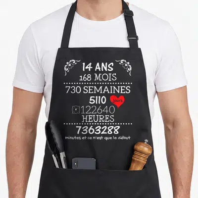 Tablier de cuisine noir avec inscription blanche 14 ans 168 mois et un cœur rouge sur fond uni.