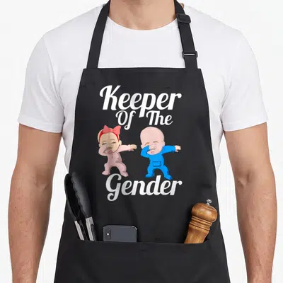 Tablier de cuisine noir avec illustration de deux nourrissons en train de faire le dab sous le texte Keeper Of The Gender