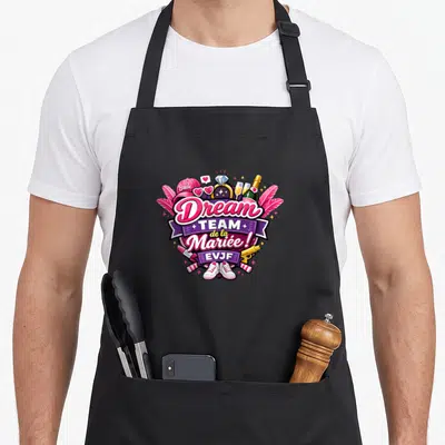 Tablier de cuisine noir avec illustration colorée Dream Team de la Mariée EVJF et accessoires festifs.