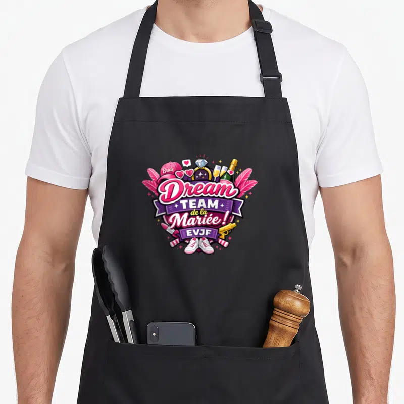 Tablier de cuisine noir avec illustration colorée Dream Team de la Mariée EVJF et accessoires festifs.