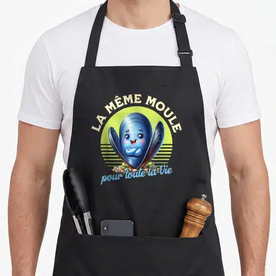 Tablier de cuisine noir avec une moule bleue souriante et le texte La même moule pour toute la vie.