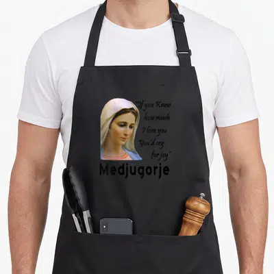 Tablier de cuisine noir avec portrait de Vierge Marie et texte Medjugorje imprimé au centre.