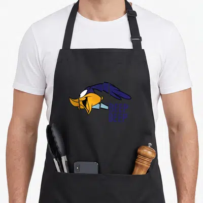 Tablier de cuisine noir avec illustration du Road Runner volant et texte Beep Beep en bleu.
