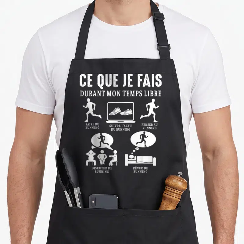 Tablier de cuisine noir avec illustration blanche illustrant les activités d'un coureur comme faire du footing, suivre l'actu et rêver de running.