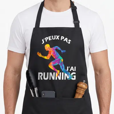 Tablier de cuisine noir avec silhouette de coureur multicolore et texte blanc J'peux pas j'ai running