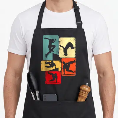 Tablier de cuisine noir avec cinq silhouettes de traceurs freerunning sur fonds rectangulaires colorés et effet vieilli.