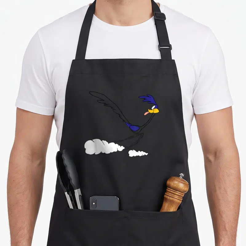 Tablier de cuisine noir avec illustration du Vautour Rapide en mouvement et nuages de poussière blancs.