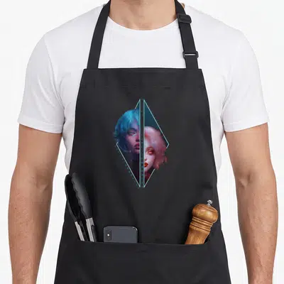 Tablier de cuisine noir avec illustration diamond cyberpunk montrant deux visages féminins aux cheveux bleus et roses séparés par une ligne verticale.
