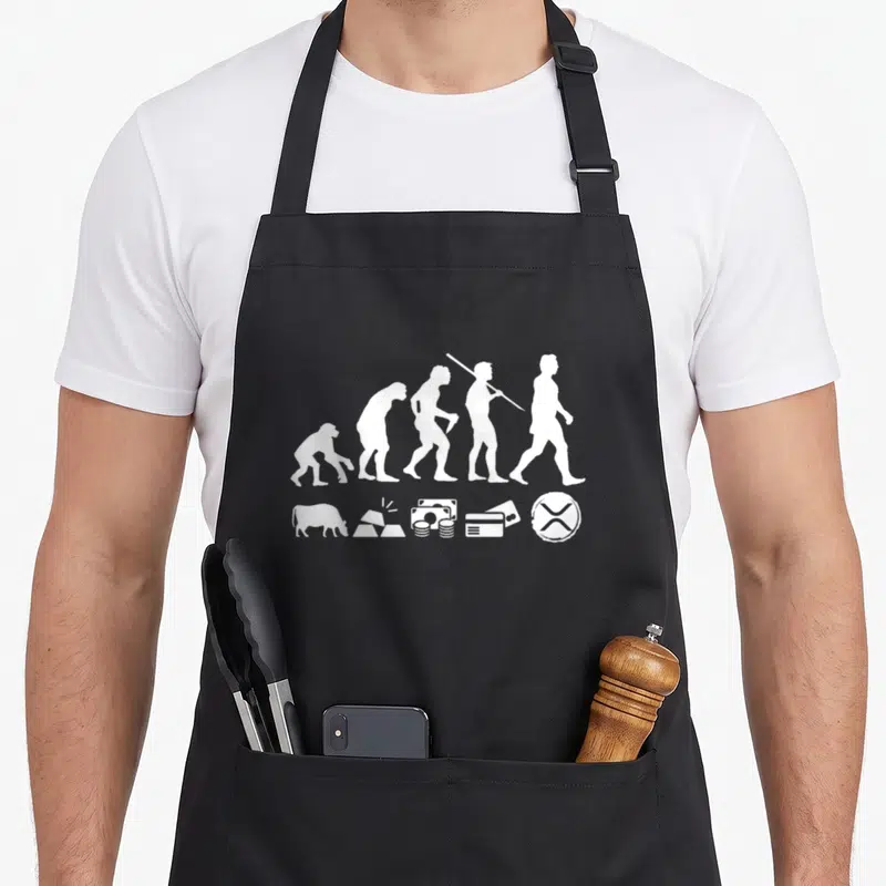 Tablier de cuisine noir avec silhouette évolutive humaine et symboles monétaires incluant Ripple XRP en blanc.