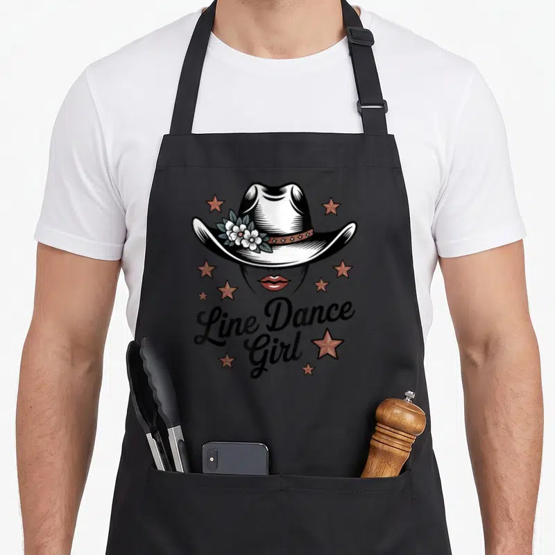 Tablier de cuisine noir avec illustration chapeau cowboy fleurs étoiles et texte Line Dance Girl