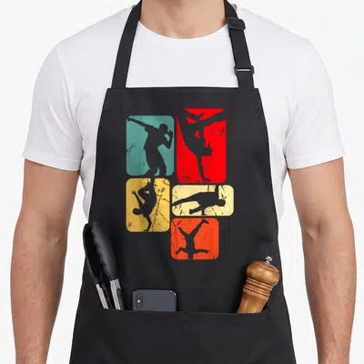 Tablier de cuisine noir avec cinq silhouettes de danseurs en mouvement sur fonds colorés.
