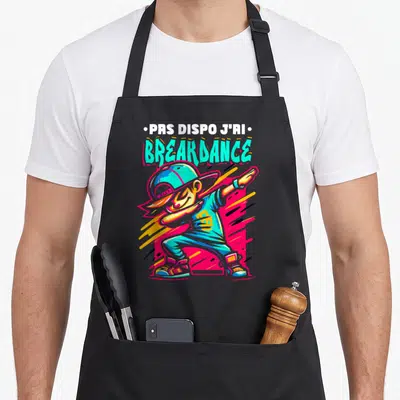 Tablier de cuisine noir avec illustration colorée d'un danseur breakdance et texte prs dispo j'ai breakdance