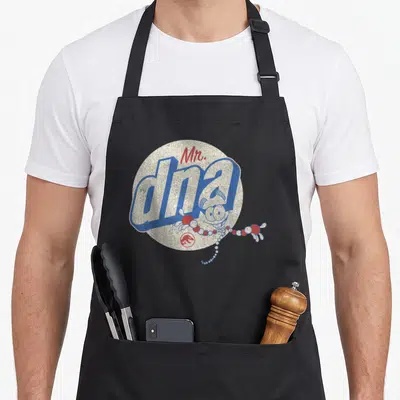 Tablier de cuisine noir avec illustration vintage Mr. DNA en bleu et rouge sur fond texturé beige.