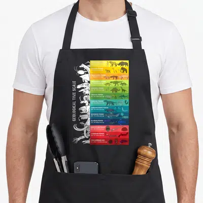 Tablier de cuisine noir avec échelle de temps géologique colorée et silhouettes d'animaux préhistoriques en blanc sur le côté gauche.