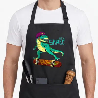 Tablier de cuisine noir avec un T-Rex vert sur des patins à roulettes et un casque violet, texte Rex Skale.