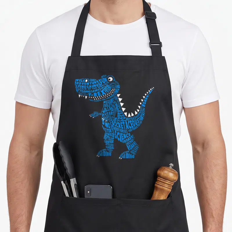 Tablier de cuisine noir avec un dinosaure bleu formé par des mots comme T-Rex et Science.