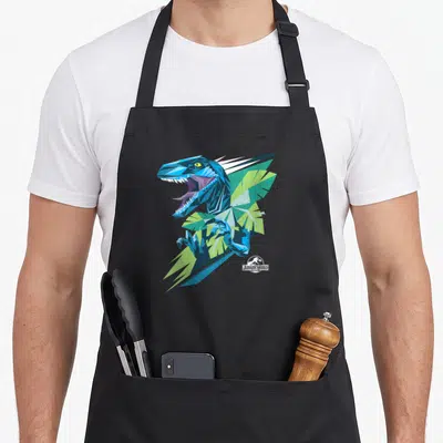 Tablier de cuisine noir avec illustration géométrique d'un raptor bleu et vert aux couleurs vives.