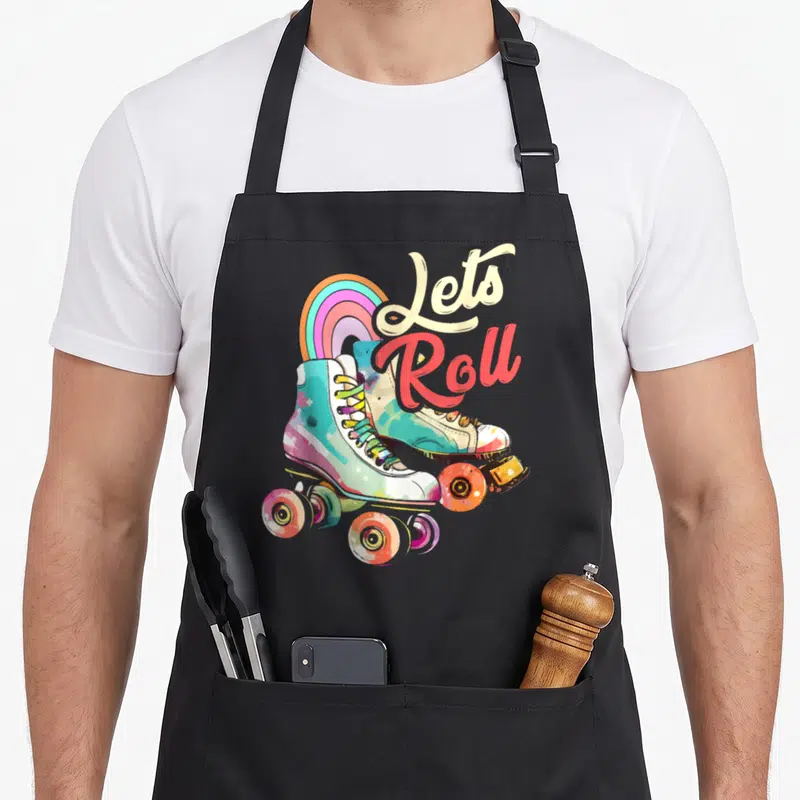 Tablier de cuisine noir avec illustration de patins à roulettes multicolores et arc-en-ciel.