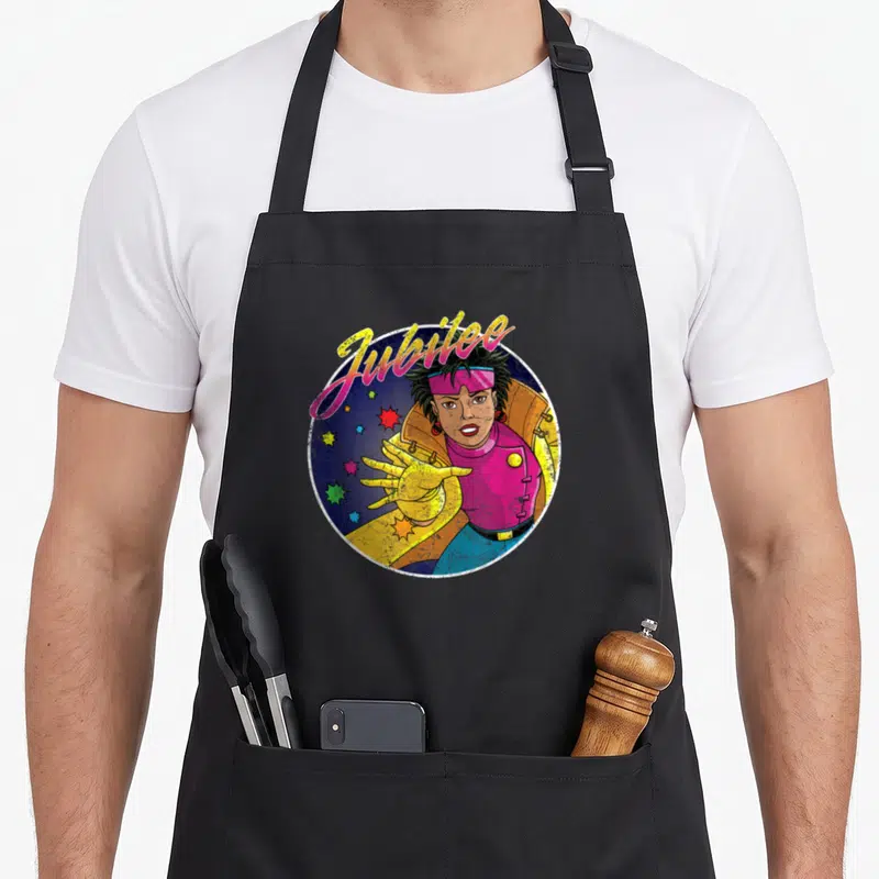 Tablier de cuisine noir avec illustration circulaire de Jubilee 90s aux couleurs vives et lettrage arc-en-ciel