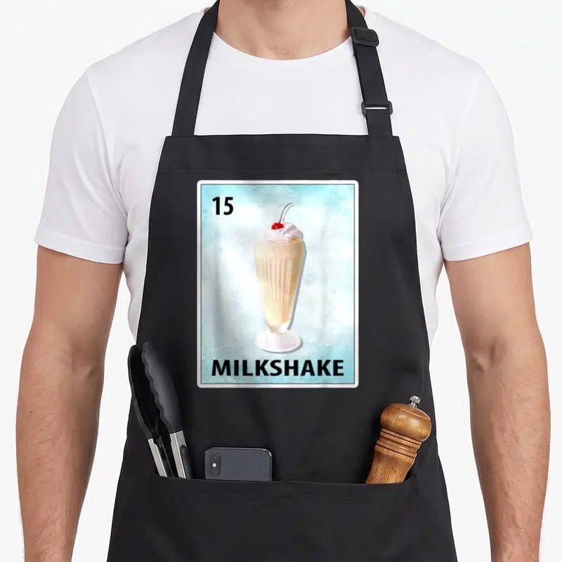 Tablier de cuisine noir avec une illustration de carte à jouer numéro 15 montrant un milkshake.