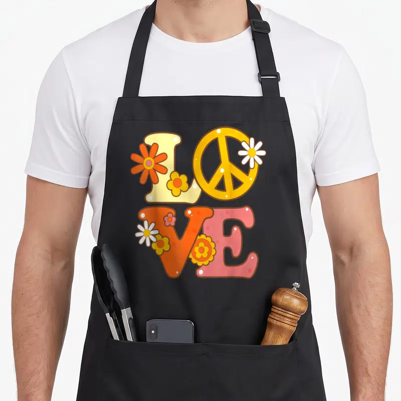 Tablier de cuisine noir avec illustration Love, signe de paix et fleurs colorées style années 60