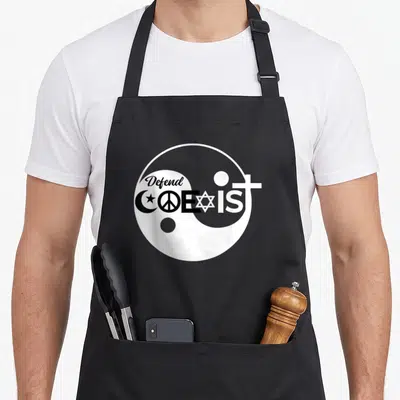 Tablier de cuisine noir avec logo blanc Defend Coexist combinant symboles religieux et Yin Yang.